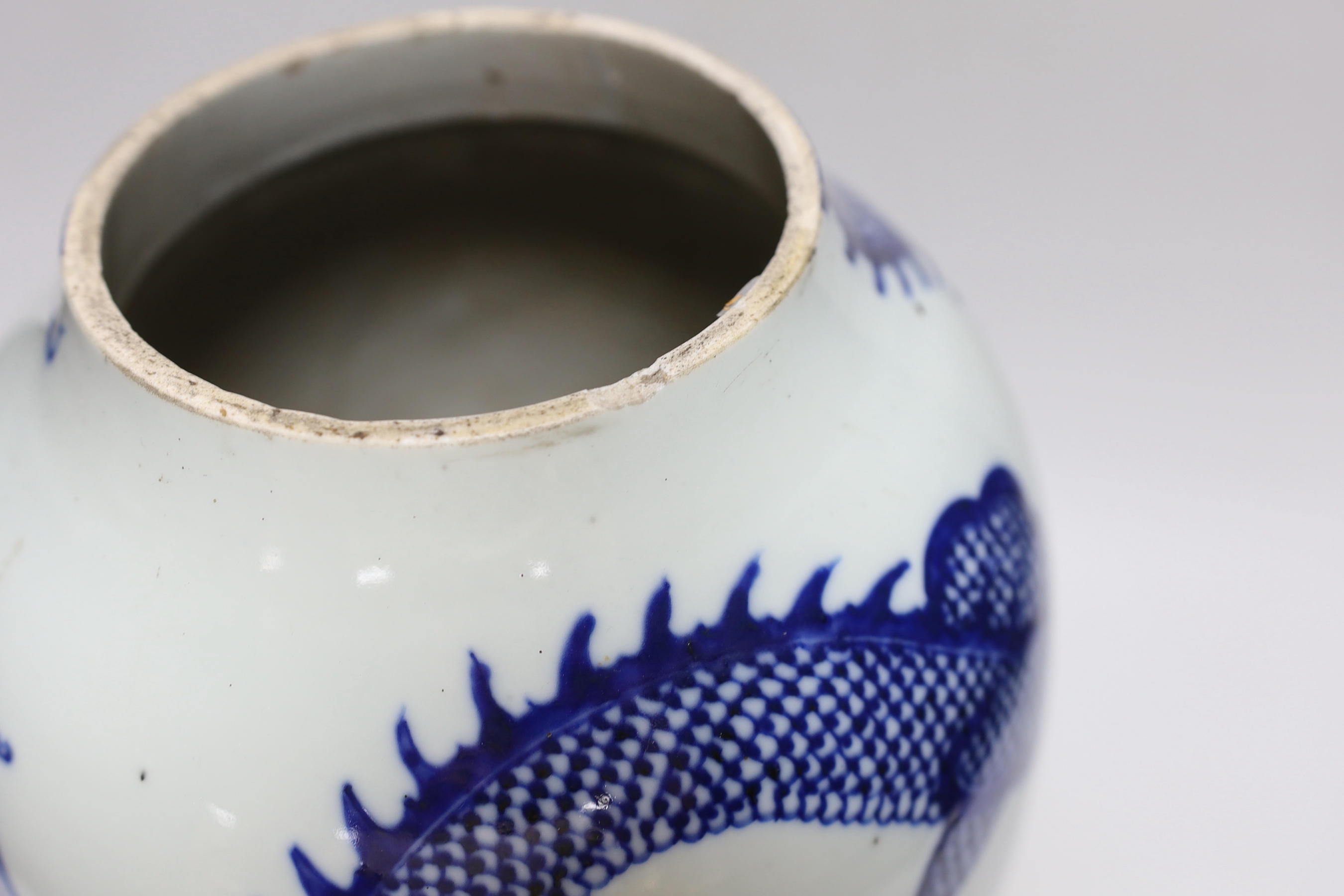 A Chinese blue and white ‘dragon’ vase, Qing dynasty, neck cut down, 33cm high